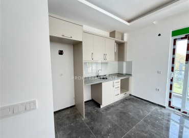 Двухкомнатная квартира, 45м², без мебели, в новостройке с бассейном в районе Махмутлар, Алания ID-18283 фото-4