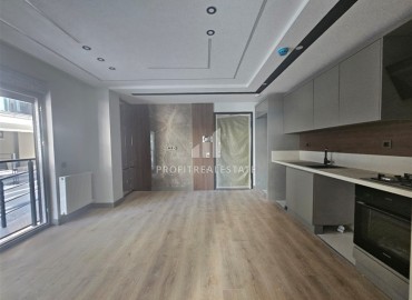 Новая недвижимость в Анталии: двухкомнатная квартира, 55м², в газифицированном комплексе в районе Муратпаша ID-18286 фото-7