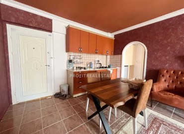 Недорогая меблированная квартира с одной спальней, 55м², в доме городского типа в Махмутларе, Алания ID-18294 фото-3