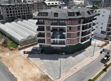 Апартаменты с одной спальней, 53м², в новостройке с отличной локацией в 200м от моря в районе Каргыджак, Алания ID-18304 фото-1