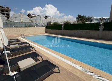 Апартаменты с одной спальней, 53м², в новостройке с отличной локацией в 200м от моря в районе Каргыджак, Алания ID-18304 фото-14