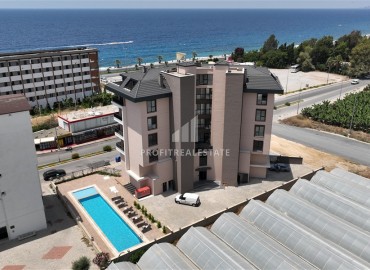 Апартаменты с одной спальней, 53м², в новостройке с отличной локацией в 200м от моря в районе Каргыджак, Алания ID-18304 фото-17