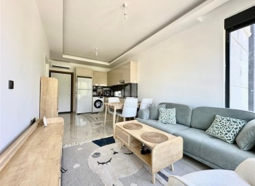 Укомплектованная квартира с одной спальней, 55м² с видом на горы в новом комплексе в Махмутларе, Алания ID-18310 фото-2