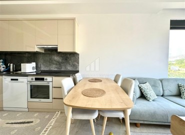 Укомплектованная квартира с одной спальней, 55м² с видом на горы в новом комплексе в Махмутларе, Алания ID-18310 фото-4