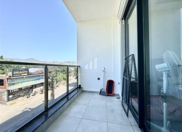 Укомплектованная квартира с одной спальней, 55м² с видом на горы в новом комплексе в Махмутларе, Алания ID-18310 фото-11