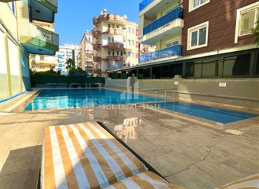 Недорогая квартира с одной спальней, 58м², в комплексе с бассейном и отличной локацией в Махмутларе, Алания ID-18312 фото-18