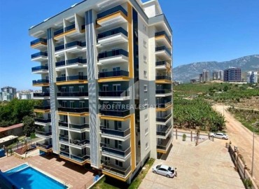 Меблированная двухкомнатная квартира, 65м², с остекленным балконом и видом на горы в в Махмутларе, Алания, 550м от моря ID-18315 фото-1