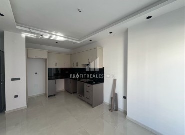 Квартира с одной спальней, 47м², в комплексе премиум класса на окончательном этапе строительства в центре Махмутлара ID-16584 фото-2