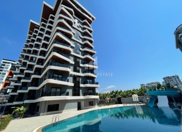 One-bedroom apartment at the final stage of construction, 400 m from the sea, in a new building with facilities, Mahmutlar, Alanya ID-16203 фото-1