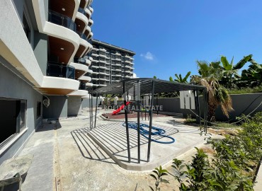 One-bedroom apartment at the final stage of construction, 400 m from the sea, in a new building with facilities, Mahmutlar, Alanya ID-16203 фото-5