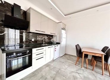 Двухкомнатные меблированные апартаменты, 56м², в комфортабельной новостройке в центре Махмутлара, Алания ID-18349 фото-2