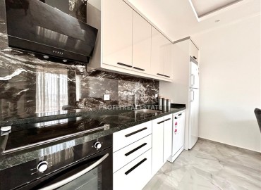 Двухкомнатные меблированные апартаменты, 56м², в комфортабельной новостройке в центре Махмутлара, Алания ID-18349 фото-3