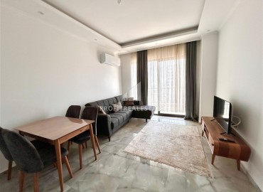 Двухкомнатные меблированные апартаменты, 56м², в комфортабельной новостройке в центре Махмутлара, Алания ID-18349 фото-5