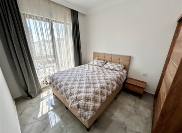 Двухкомнатные меблированные апартаменты, 56м², в комфортабельной новостройке в центре Махмутлара, Алания ID-18349 фото-7