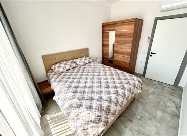 Двухкомнатные меблированные апартаменты, 56м², в комфортабельной новостройке в центре Махмутлара, Алания ID-18349 фото-8