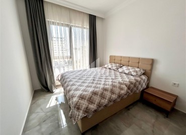 Двухкомнатные меблированные апартаменты, 56м², в комфортабельной новостройке в центре Махмутлара, Алания ID-18349 фото-9