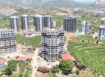 Трехкомнатные апартаменты, 90м², в комплексе премиум класса на этапе строительства в Махмутларе, в 850м от моря, Алания ID-18362 фото-14