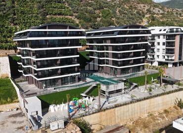 Profitable investment project 600 meters from Cleopatra beach in a residence with developed facilities in the center of Alanya ID-10993 фото-2