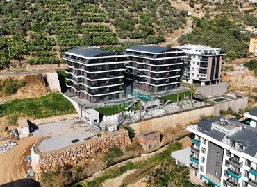 Profitable investment project 600 meters from Cleopatra beach in a residence with developed facilities in the center of Alanya ID-10993 фото-3