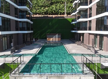 Profitable investment project 600 meters from Cleopatra beach in a residence with developed facilities in the center of Alanya ID-10993 фото-5