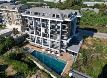 Дуплекс с двумя спальнями в стиле «лофт», 85м², в комплексе премиум класса в 300м от моря в районе Каргыджак, Алания ID-18392 фото-1