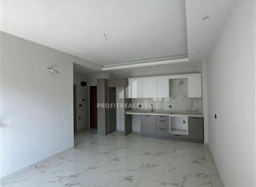 Новая квартира с одной спальней, 50м², в комфортабельном комплексе, в 550м от моря в районе Тосмур, Алания ID-18404 фото-2