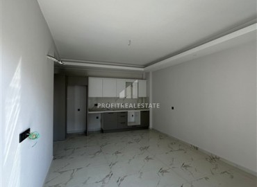 Новая квартира с одной спальней, 50м², в комфортабельном комплексе, в 550м от моря в районе Тосмур, Алания ID-18404 фото-4