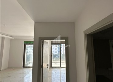 Новая квартира с одной спальней, 50м², в комфортабельном комплексе, в 550м от моря в районе Тосмур, Алания ID-18404 фото-5