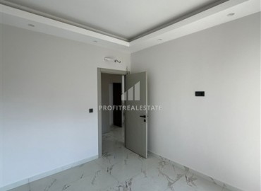 Новая квартира с одной спальней, 50м², в комфортабельном комплексе, в 550м от моря в районе Тосмур, Алания ID-18404 фото-7