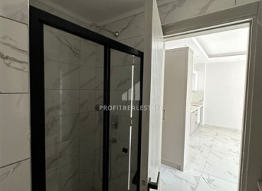 Новая квартира с одной спальней, 50м², в комфортабельном комплексе, в 550м от моря в районе Тосмур, Алания ID-18404 фото-9