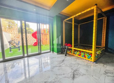 Новая квартира с одной спальней, 50м², в комфортабельном комплексе, в 550м от моря в районе Тосмур, Алания ID-18404 фото-16