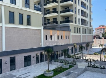 Комфортабельная двухкомнатная квартира, 58,5м², в комплексе с полной инфраструктурой, у моря в Махмутларе, Алания ID-18409 фото-2