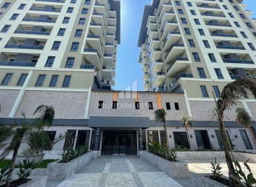 Комфортабельная двухкомнатная квартира, 58,5м², в комплексе с полной инфраструктурой, у моря в Махмутларе, Алания ID-18409 фото-5