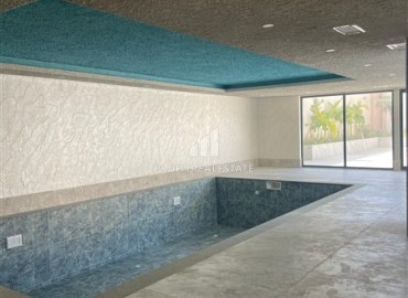 Комфортабельная двухкомнатная квартира, 58,5м², в комплексе с полной инфраструктурой, у моря в Махмутларе, Алания ID-18409 фото-11