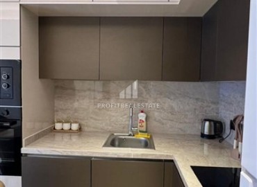 Меблированные апартаменты 1+1, 55м², в комплексе с отельной инфраструктурой на первой береговой линии в Махмутларе, Алания ID-18412 фото-5