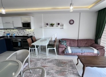 Меблированные двухкомнатные апартаменты, 65м², в комплексе премиум класса в 300м от моря в центре Махмутлара, Алания. ID-18415 фото-2