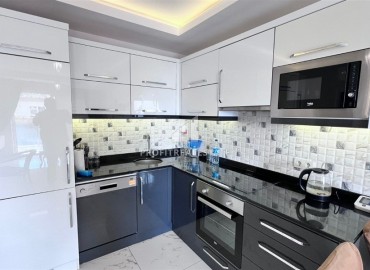 Меблированные двухкомнатные апартаменты, 65м², в комплексе премиум класса в 300м от моря в центре Махмутлара, Алания. ID-18415 фото-4