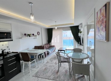 Меблированные двухкомнатные апартаменты, 65м², в комплексе премиум класса в 300м от моря в центре Махмутлара, Алания. ID-18415 фото-5