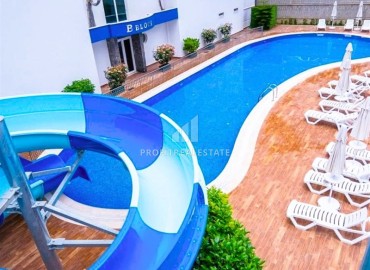 Меблированные двухкомнатные апартаменты, 65м², в комплексе премиум класса в 300м от моря в центре Махмутлара, Алания. ID-18415 фото-19