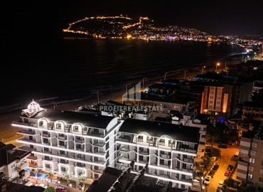 Уютная двухкомнатная квартира, 82,5м², в новостройке премиум класса на первой береговой линии в центре Алании под ВНЖ ID-18421 фото-1