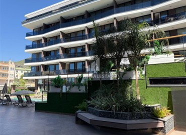 Новая элитная недвижимость в центре Алании, в 450м от моря: апартаменты с одной спальней, 55м², без мебели ID-18425 фото-1