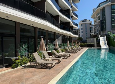 Новая элитная недвижимость в центре Алании, в 450м от моря: апартаменты с одной спальней, 55м², без мебели ID-18425 фото-11