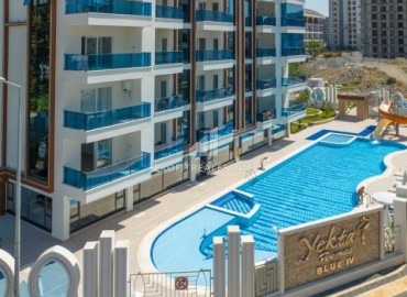 Квартира с одной спальней, 54м², в элитной резиденции в Махмутларе, в 750м от моря, Алания ID-18433 фото-12