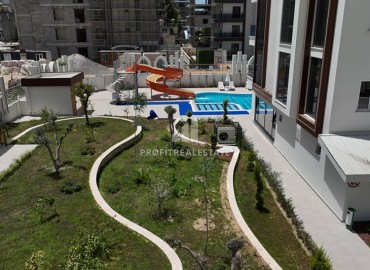 Квартира с одной спальней, 54м², в элитной резиденции в Махмутларе, в 750м от моря, Алания ID-18433 фото-13