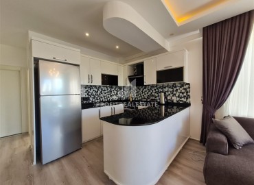 Уютные апартаменты с одной спальней, 50м², в резиденции с хорошей инфраструктурой в 300м от моря в Махмутларе, Алания ID-18438 фото-7