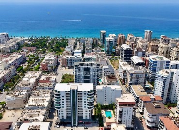 Видовая двухкомнатная меблированная квартира 60м² в новой резиденции в центре Махмутлара, Алания ID-18460 фото-1