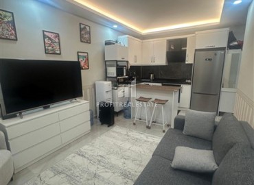 Уютная квартира с одной спальней, 45м², в новостройке в 250 метрах от моря в районе Оба, Алания ID-18461 фото-2