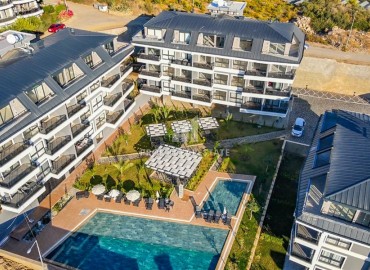 Уютная двухкомнатная квартира, 55м², в новой резиденции премиум класса в Конаклы, Алания, 300м от моря ID-18471 фото-1