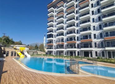 Апартаменты с одной спальней, 55м², в новом комплексе с отельной инфраструктурой и частным пляжем в районе Алании - Демирташ ID-18474 фото-1