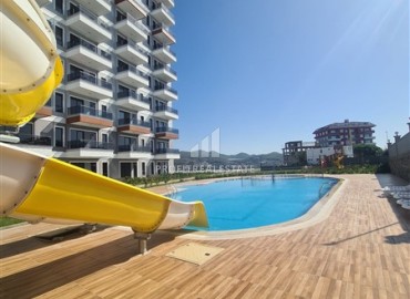 Апартаменты с одной спальней, 55м², в новом комплексе с отельной инфраструктурой и частным пляжем в районе Алании - Демирташ ID-18474 фото-11